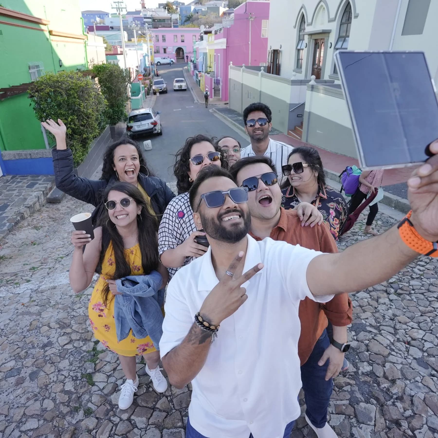 A group selfie on a cobbled street