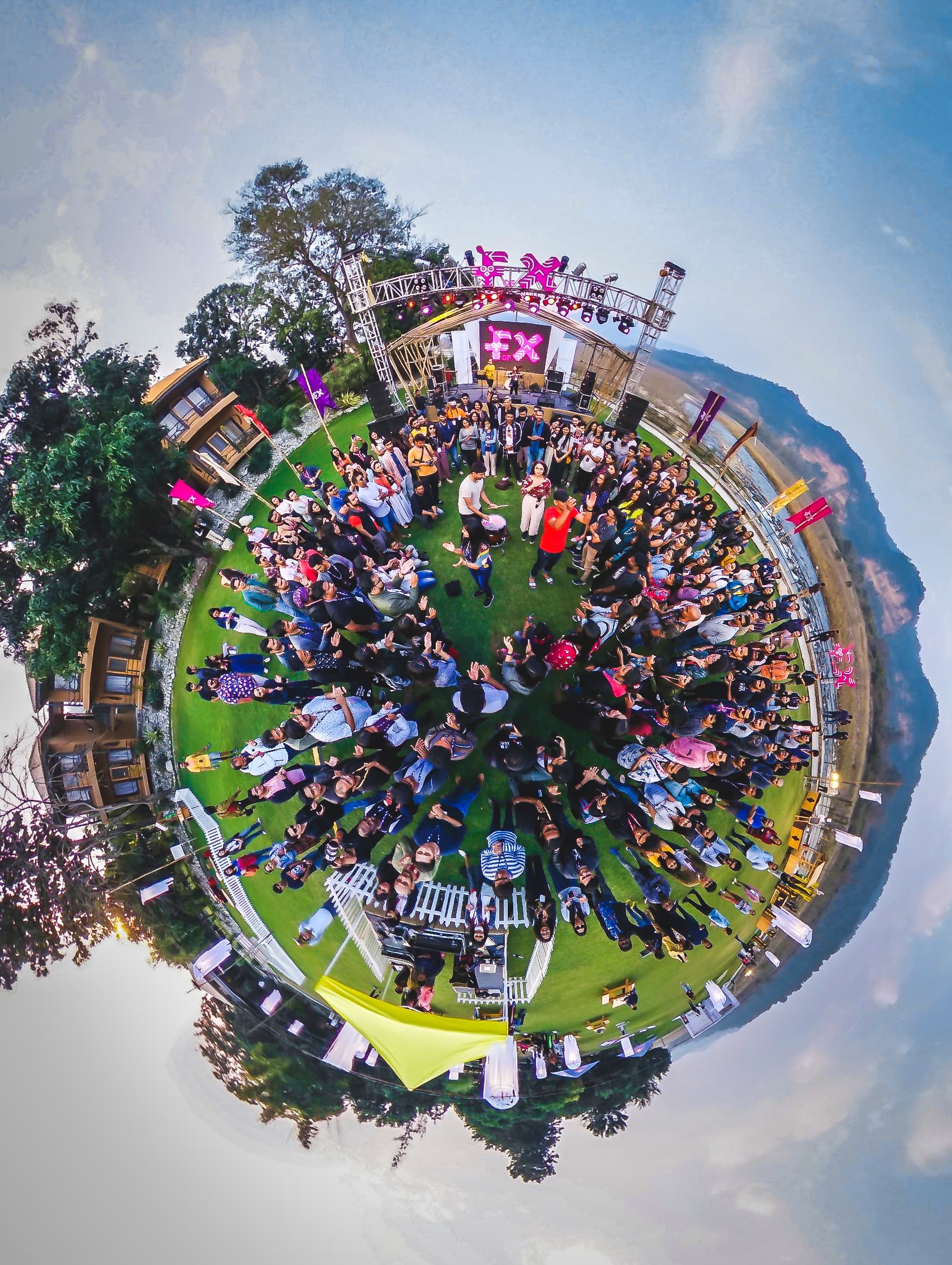An aerial view of the F of X crowd gathered in the forest