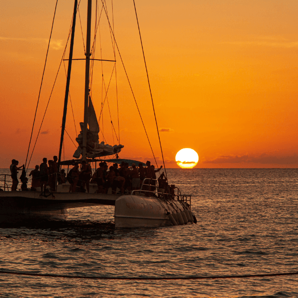 Watch a surreal sunset on a private catamaran in Ibiza