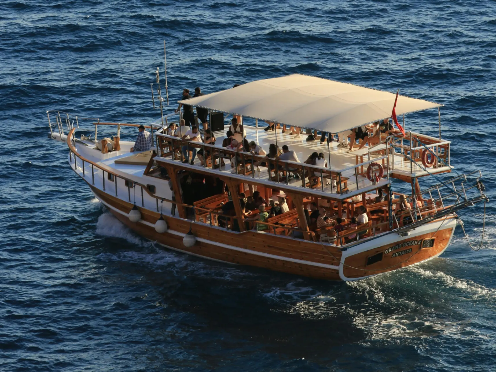 A full day on a private catamaran in the Aegean, anchored swim stops in turquoise coves, snacks on board, nothing on the schedule