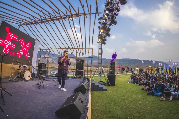An ExCo host on an outdoor stage